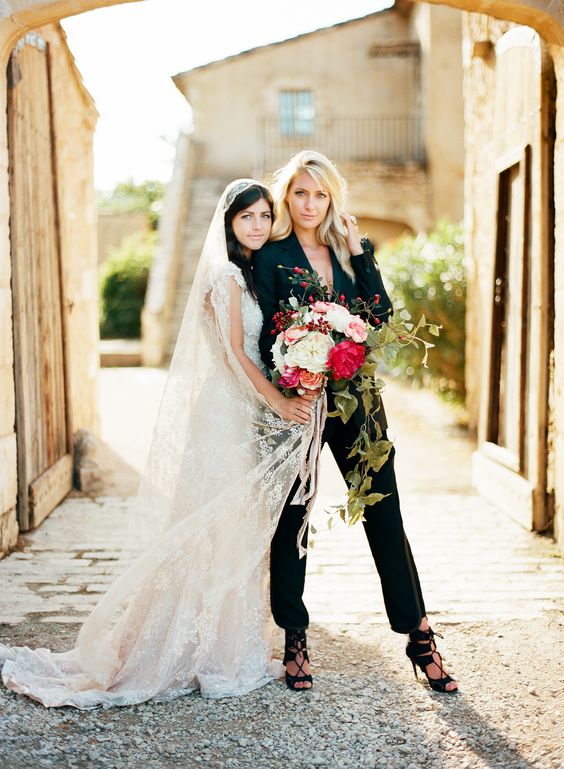a black pantsuit, a black bra and black strappy heels for a gorgeous statement bridal look