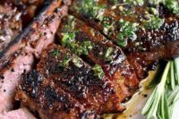 14 a perfect grilled steak with herb butter features a homemade dry rub and melty herb butter finish