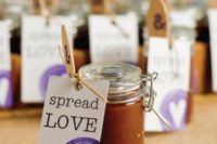14 tiny jars of homemade apple butter with a special message make a unique and sweet gift