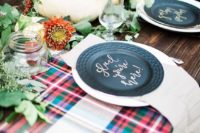 15 a rustic bridal shower tablescape with plaid table runners, a greenery runner with blooms, pumpkins and black chargers