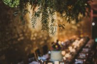 16 lush greenery decoration over the reception creates an outdoorsy feeling inside