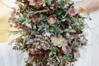 17 a textural fall wedding bouquet with grene and brown and burgundy blooms and leaves