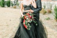 17 a trendy two piece black wedding dress with a strapless crop top and a layered tulle skirt