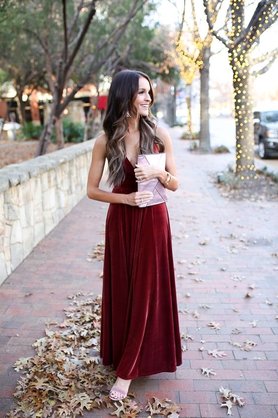 a burgundy velvet maxi dress with spaghetti straps, lilac shoes and a lilac clutch