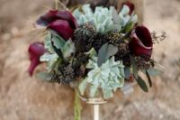 18 a moody Halloween wedding bouquet with succulents, dark callas and seeded eucalyptus