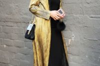 19 a black slip dress, black strappy shoes, a gold trench and a black bag for a wow look