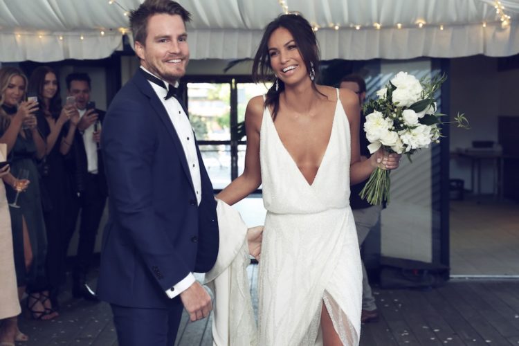 a fresh take on a classic slip with a fully embellished slip wedding dress with a plunging neckline and a high front slit