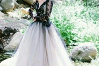 20 a beautiful A-line wedding dress with a black lace top with long sleeves and a black tulle overskirt for a wow look