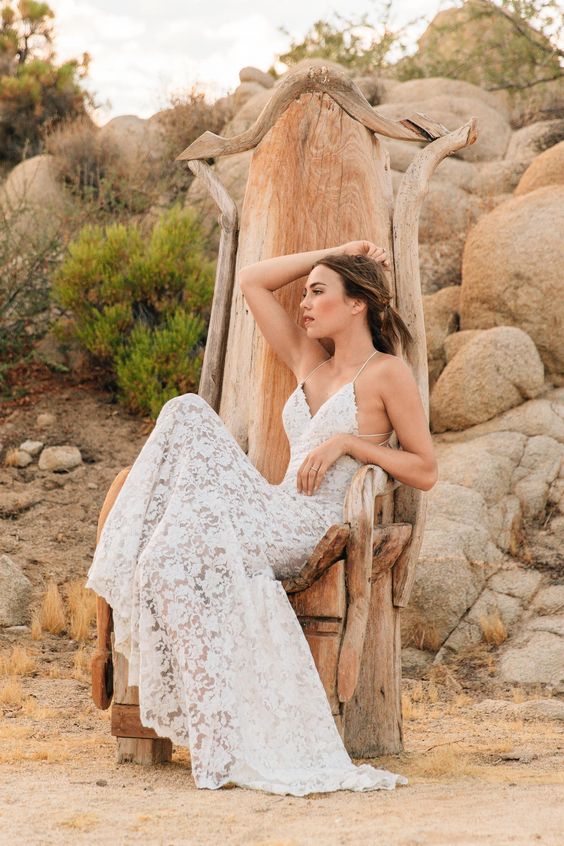 a lace slip gown with a deep V-neckline and an open back for a romantic feel