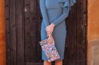 21 a muted blue knee dress with an asymmetric ruffle detail, a floral clutch and red shoes
