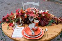 22 a lush wedding table runner done with bright blooms and fall leaves in jewel tones is a fantastic idea for the fall