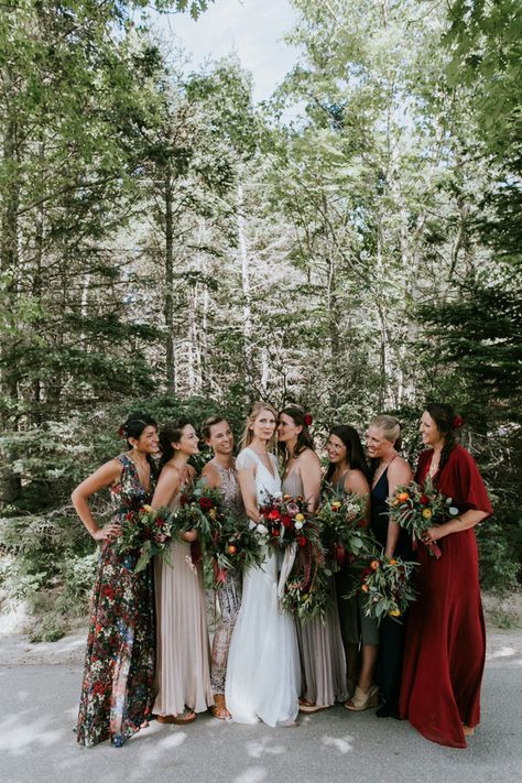 mismatched bridesmaids' dresses in green, grey, red and with floral prints to show off bridesmaids' style