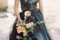24 a wedding dress with a grey and black lace bodice and a layered grey and black skirt