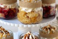 24 little mason jar pies with a burlap trim is great for fall bridal shower desserts