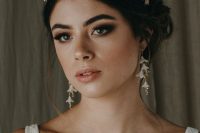 a beautiful floral bridal tiara with leaves and matching earrings will make your look feminine, chic and delicate