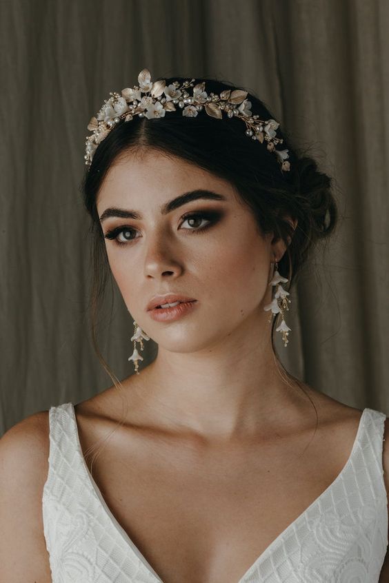 a beautiful floral bridal tiara with leaves and matching earrings will make your look feminine, chic and delicate