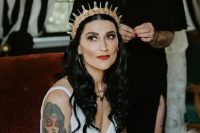 a bold and shiny gold and crystal bridal tiara is a fantastic solution for a modern bride who wants to give an edge to her look