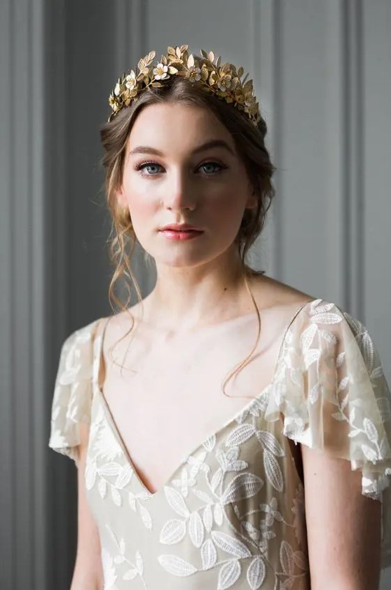 a delicate flower and leaf gold tiara is a beautiful idea for a wedding, it can be worn with many dresses and rocked in many styles