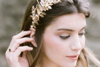 a gold leaf bridal tiara is a pretty statement-like headpiece that can add a glam feel to the look