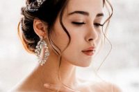 a gorgeous embellished flower bridal tiara with matching earrings for a formal and sophisticated bridal look