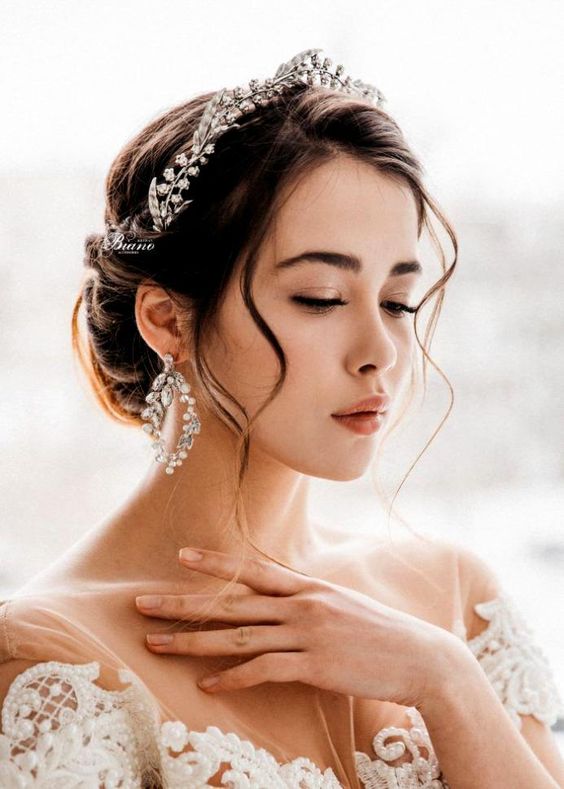 a gorgeous embellished flower bridal tiara with matching earrings for a formal and sophisticated bridal look