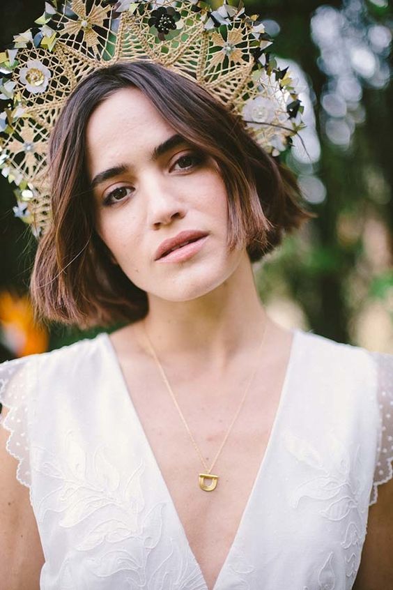 a jaw-dropping boho woven bridal tiara with rhiny touches, flowers and green touches for a unique boho bridal look