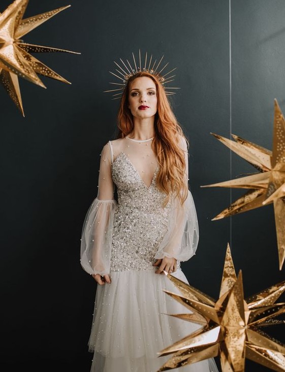 a spiked bridal tiara with some stars and a matching embellished wedding dress for a modern celestial bride