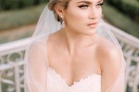 an exquisite embellished tiara paired with a veil is a very chic and refined idea, it will finish off a formal bridal look
