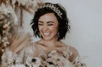 loose waves and a gorgeous statement rhinestone tiara to illuminate the look and make the bride stand out