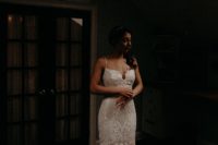 02 The bride was wearing a beautiful lace mermaid wedding gown with spaghetti straps, a train and a touch of sparkle