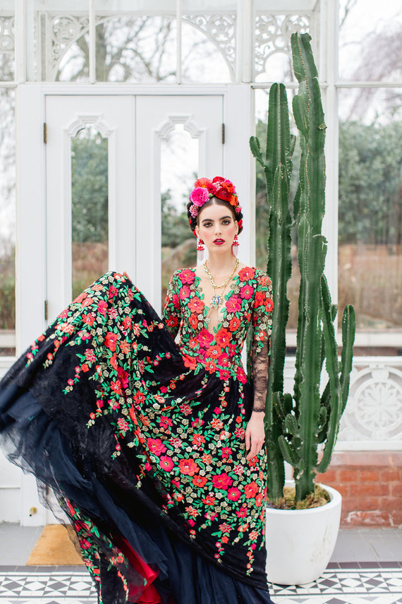 The first bridal look was with a black wedding dress with right florals and a bold floral crown
