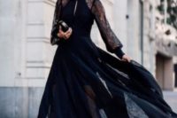 02 a beautiful maxi black dress with a partly sheer skirt and a cutout on the neckline