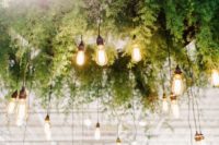 02 a large greenery wedding chandelier with lots of bulbs hanging down is a great idea for a reception or a dance floor