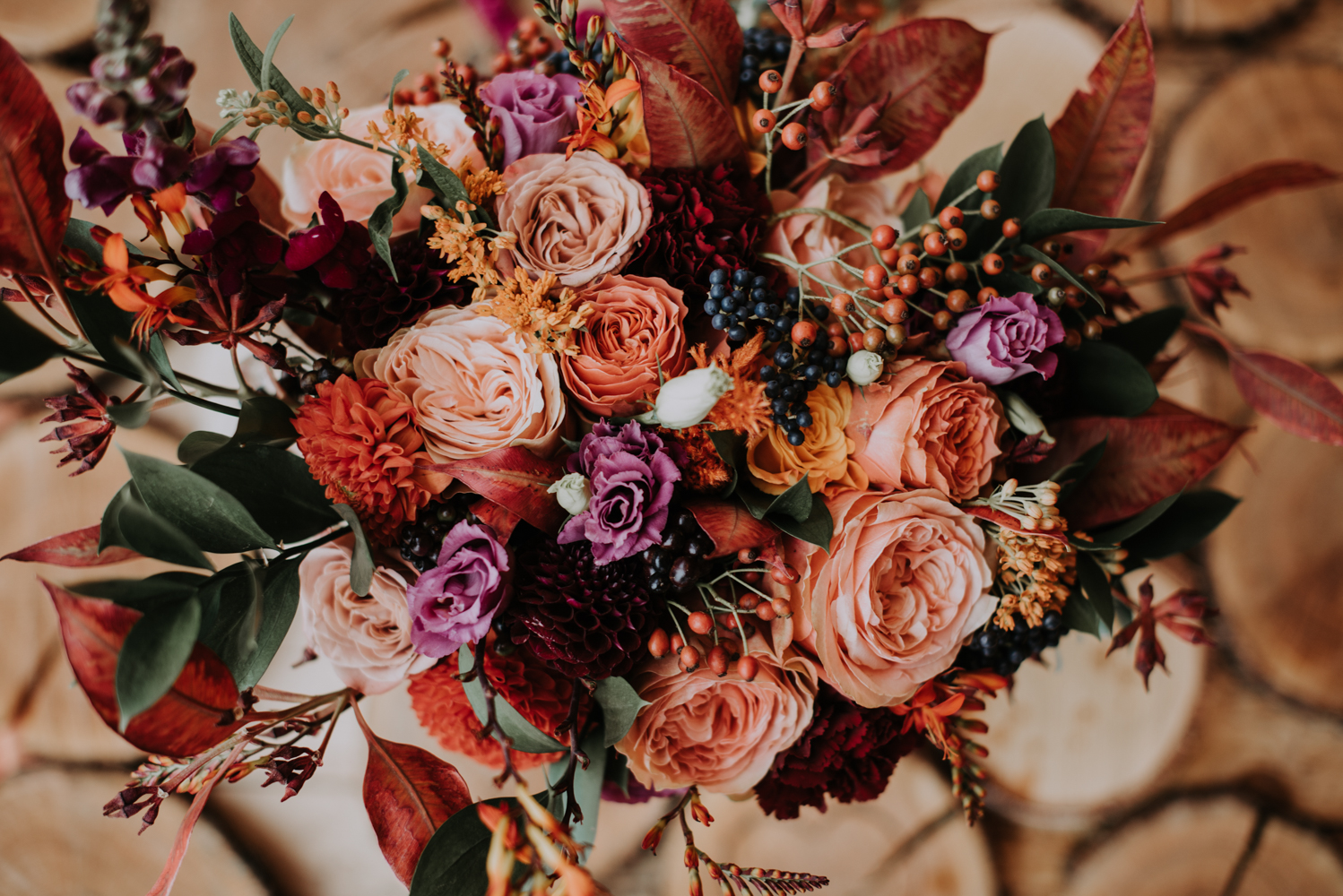 The bride made up her bouquet herself using blooms of fall colors and greenery