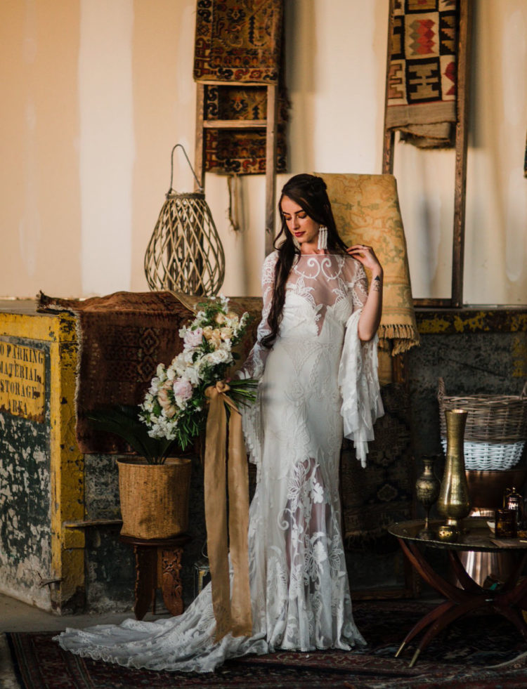 The bride was wearing a fantastic Rue De Seine wedding dress with a lace overlay and bell sleeves