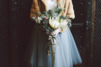 04 a chic bridal separate with a creamy top and a blue tulle midi skirt, a faux fur coverup