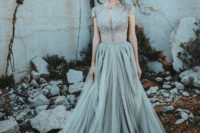 05 The bride was wearing a two piece grey wedding dress with a tulle blouse and a layered full skirt with a train