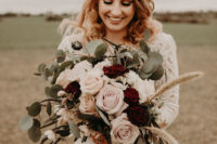 05 The wedding bouquet was done with white, blush and burgundy blooms plus grasses