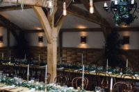 05 overhead wedding decor with cascading greenery, bulbs and a sphere candle chandelier