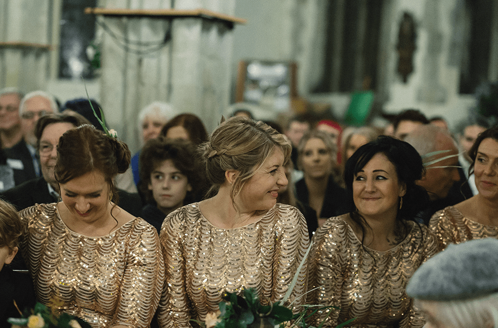 The bridesmaids were wearing gold sequin gowns and rocking updos