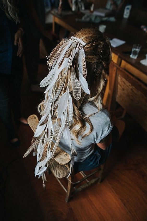 a wild feather bridal veil is a unique and creative idea to go for