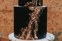 07 a chic modern black wedidng cake with touches of gold is a great idea for a modern Halloween wedding