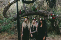 07 bridesmaids wearing mismatched black gowns and colorful floral crowns for the bridal shower