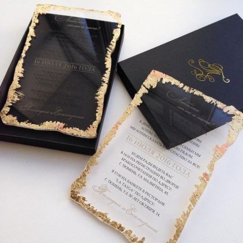 a modern wedding invitation suite in navy and with acrylic invites with a gold foil edge
