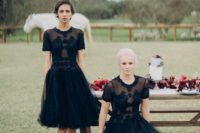 11 chic black embroidered embellished black dresses, with a sheer bodice and a knee or maxi skirt