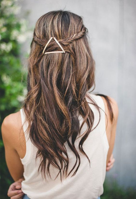 11a fishtail braided half updo with waves and an eye-catchy geometric hairpiece that adds a boho feel