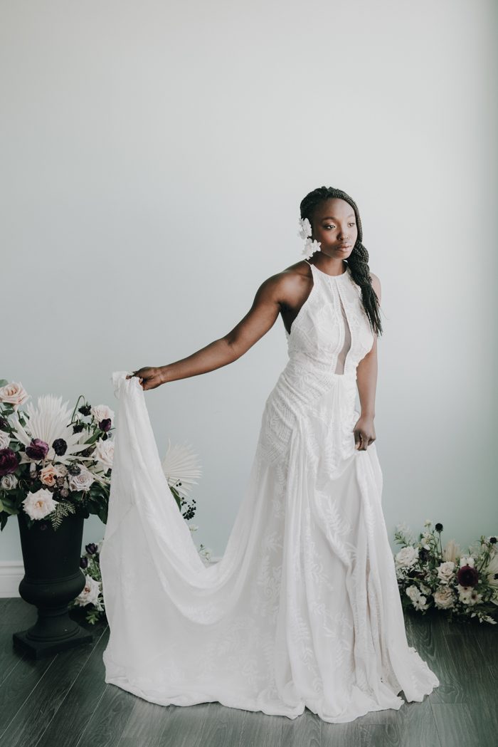 A lace halter neckline wedding dress with a train is ideal for a boho bride