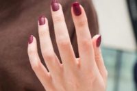 12 a bold fall take on the traditional FRench manicure, a matte burgundy nail and a shiny burgundy tip