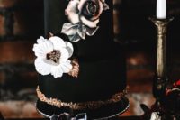 12 a matte black wedding cake with handpainted blooms, copper touches and a couple of sugar blooms