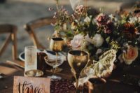 13 moody boho touches – dusty-colored blooms, herbs and some petals on the table for a boho mountain wedding